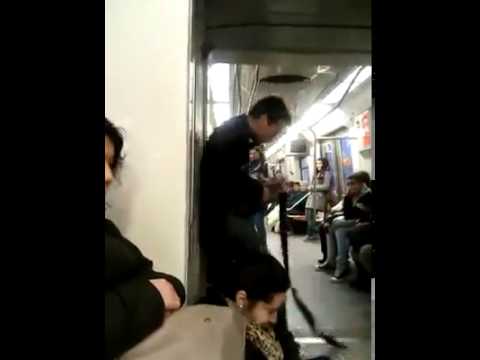 Crazy guy playing guitar in train